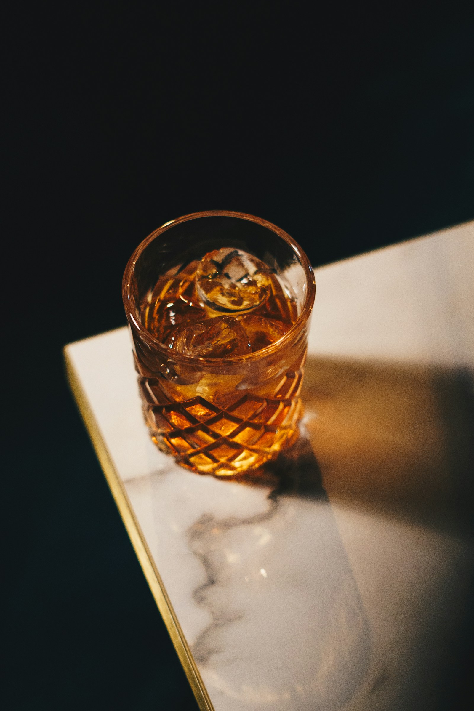 An unbranded amber beverage in a glass